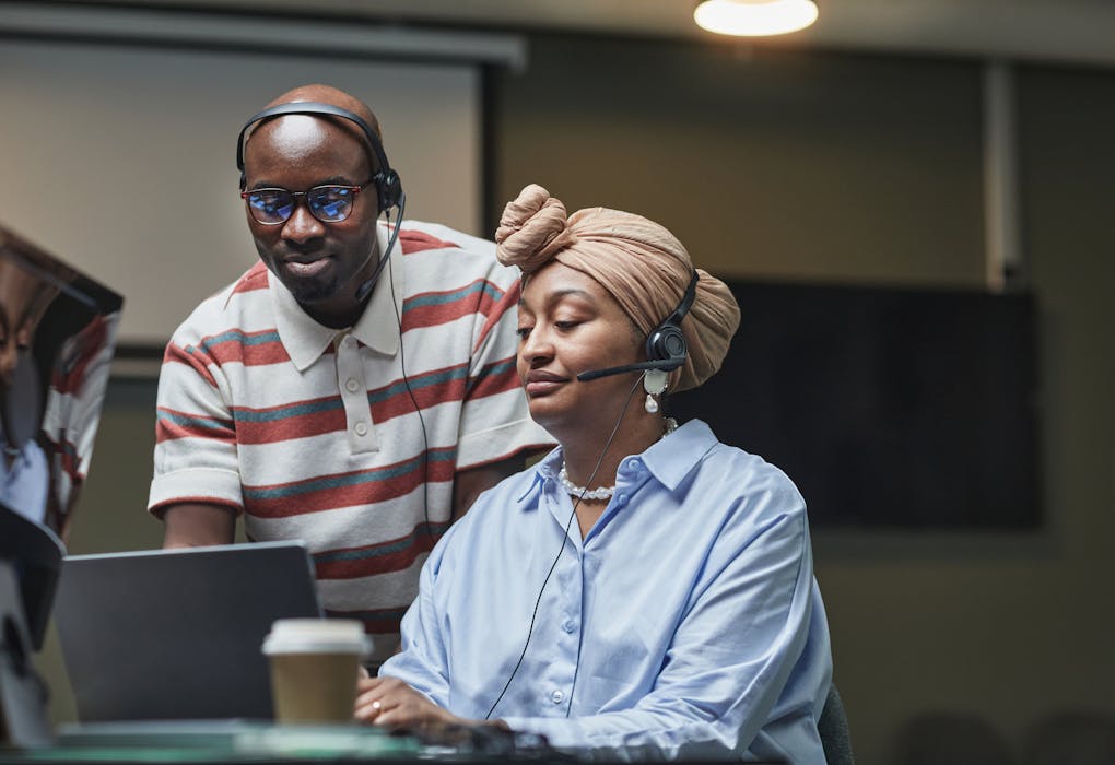 Multiethnic team working together in an office, showcasing diversity and collaboration.