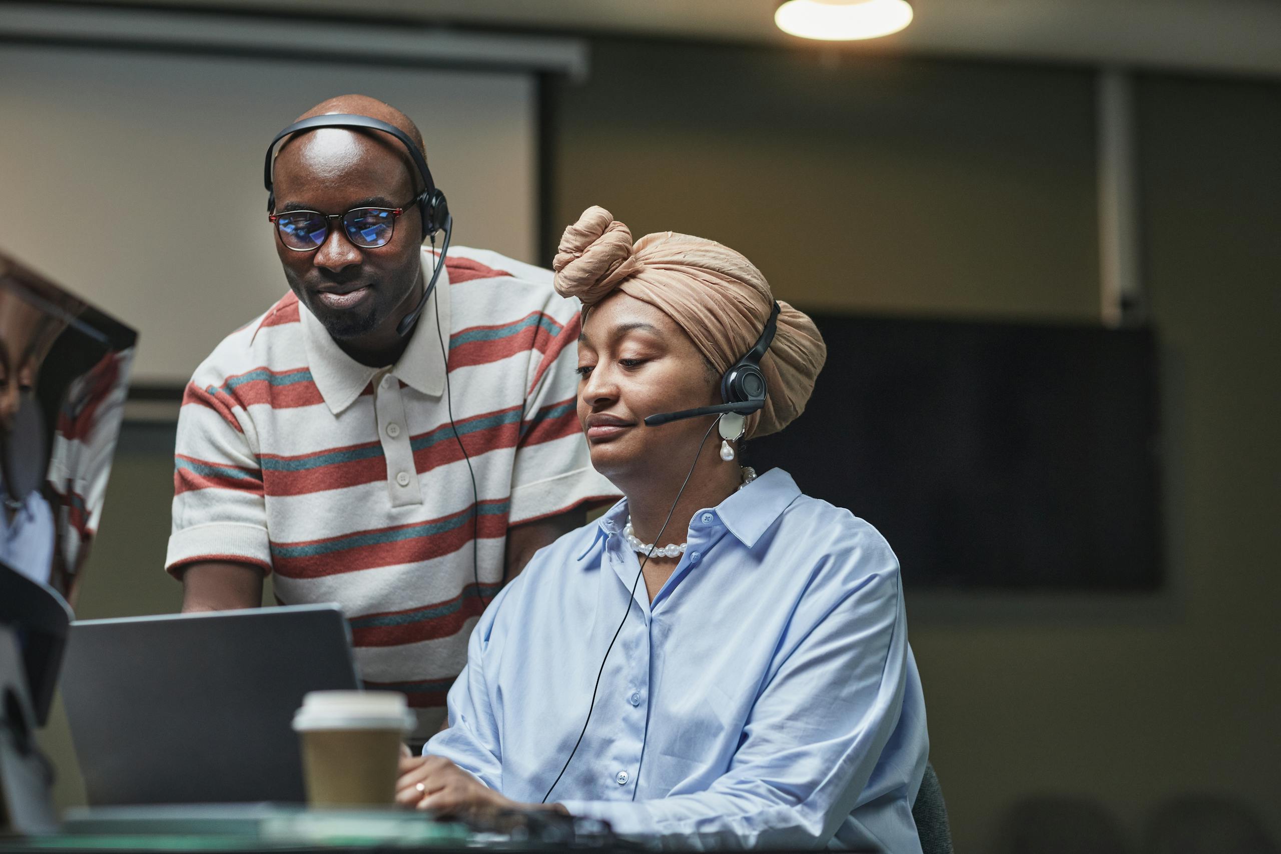 Multiethnic team working together in an office, showcasing diversity and collaboration.